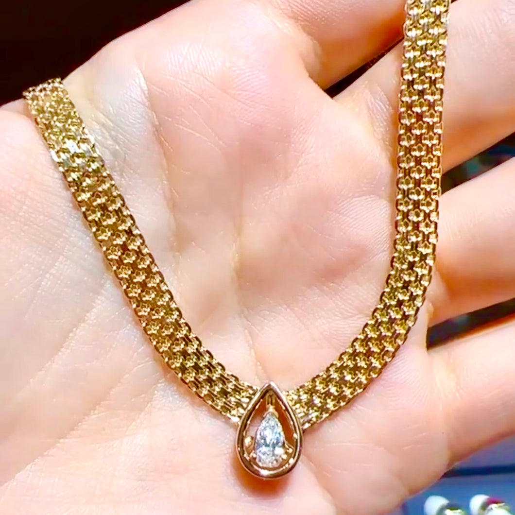 Slightly elongated diamond pear necklace
